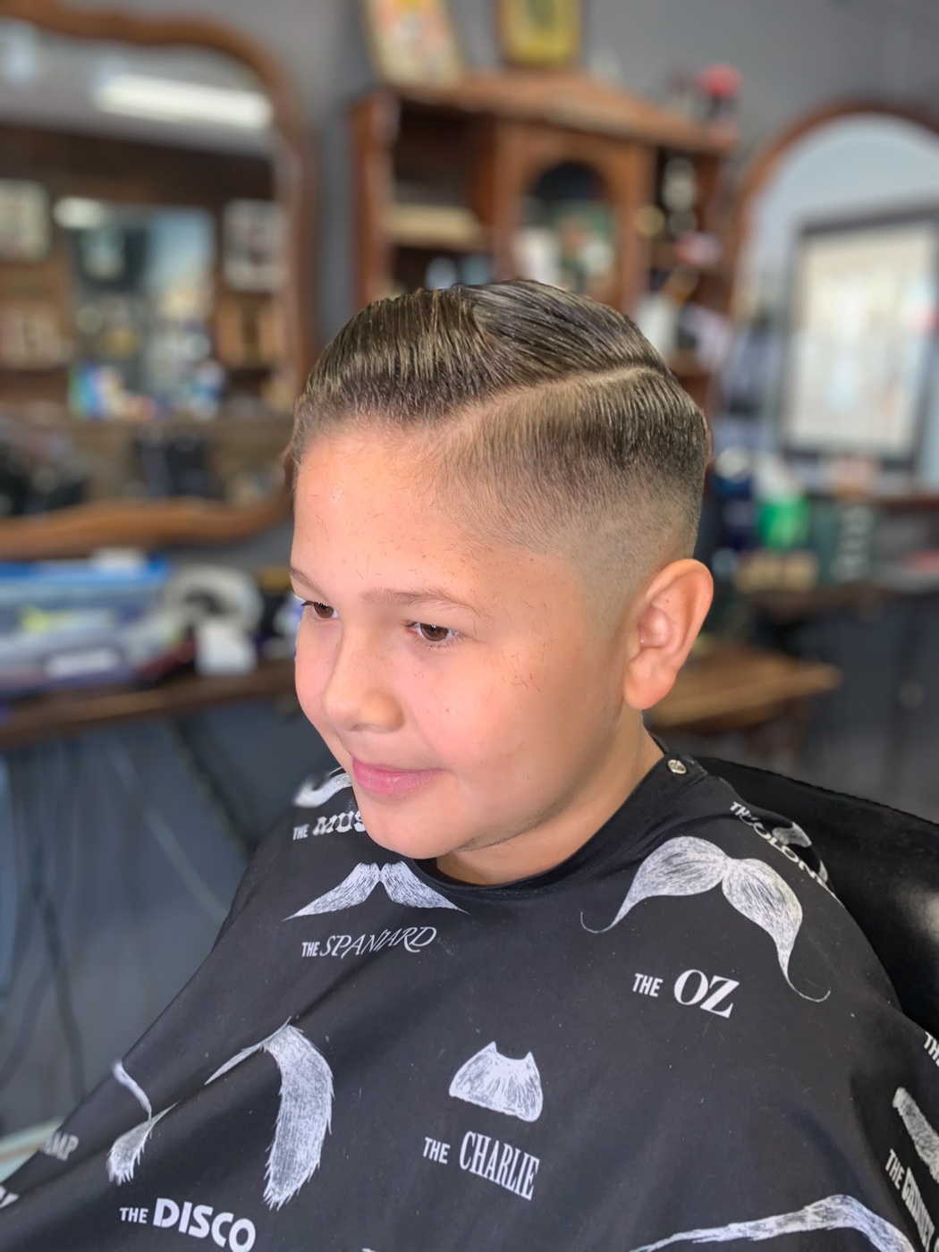 Young client's fresh haircut at Truly Blessed Barber Studio